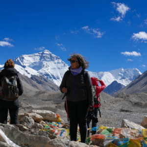 Travelers acclimatizing during a Tibet trek with views of the high-altitude Tibetan plateau, preparing for Everest Base Camp and Mount Kailash.